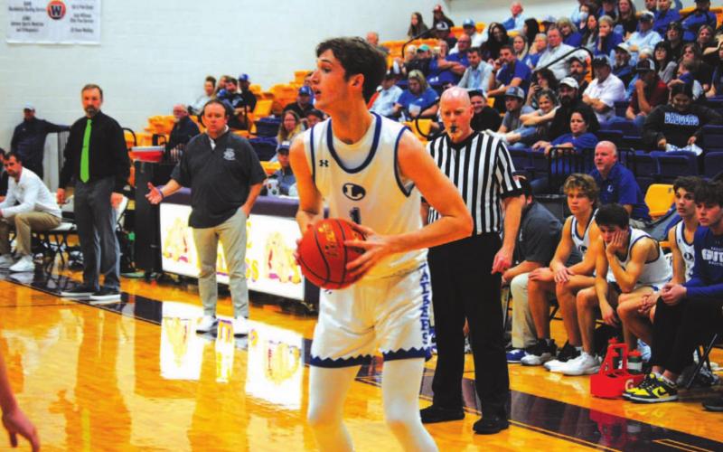 Kaeden Crawford squares up in front of an Iowa Park defender before driving to the basket for a layup. HUNTER KING | DISPATCH RECORD