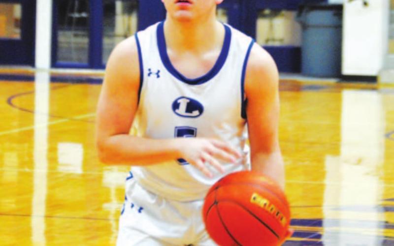 Dax Brookreson prepares to shoot a free throw against Iowa Park. HUNTER KING | DISPATCH RECORD