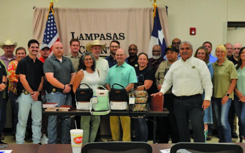 Lampasas County Sheriff’s Office staff stand alongside faith leaders who were recognized at a department meeting last Wednesday. ERICK MITCHELL | DISPATCH RECORD