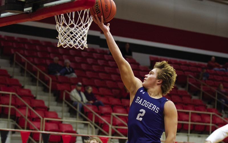 HUNTER KING | DISPATCH RECORD Haegan Oncken flips the ball off the glass on a fast break during Tuesday’s game.