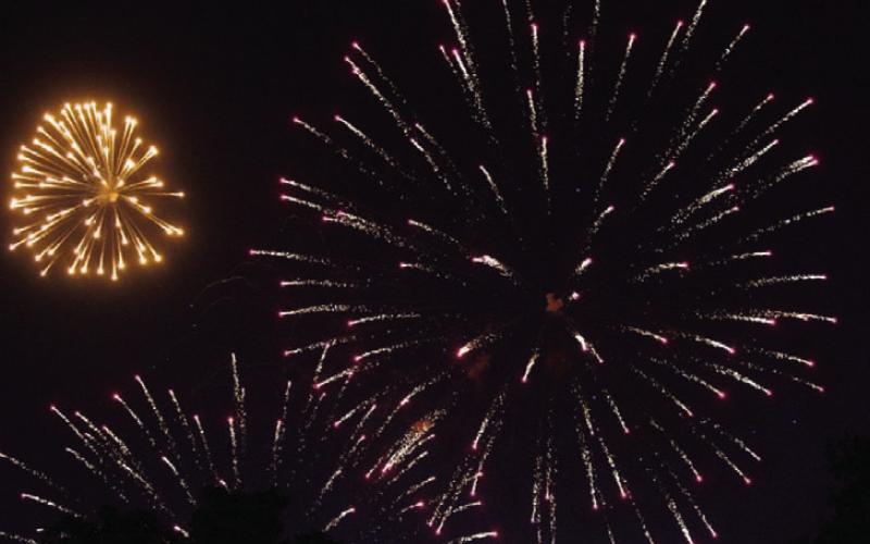 Fireworks, pictured above and below, adorn the sky Wednesday night. The display, which follows Gospel Night, is a popular midweek offering of the Spring Ho festival. MASON HINES | DISPATCH RECORD