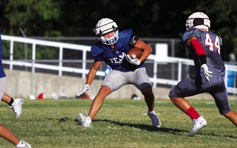 HUNTER KING | DISPATCH RECORD Haegan Oncken puts his foot in the ground to make a defender miss.