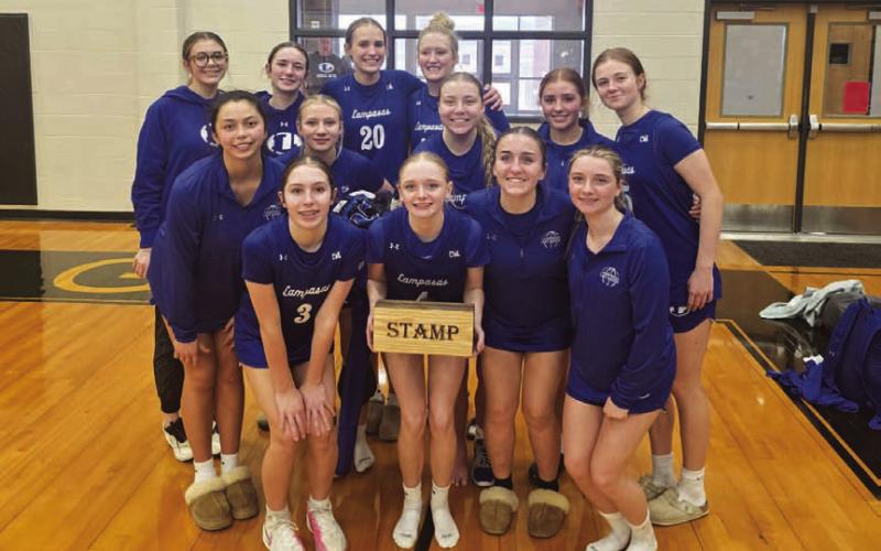 COURTESY PHOTO The Lady Badgers pose with the STAMP award at the Brady tournament.
