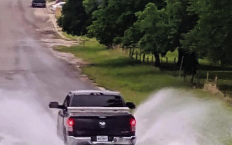 A pickup drives across the low-water crossing on South Willis in west Lampasas Tuesday. The county has received more than five inches of precipitation this month. COURTESY PHOTO