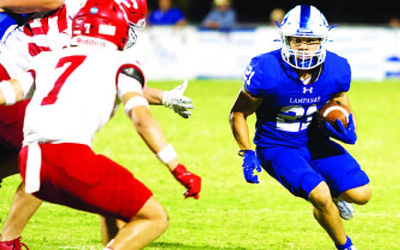 HUNTER KING | DISPATCH RECORD KJ Reed looks for room to run against Fredericksburg.