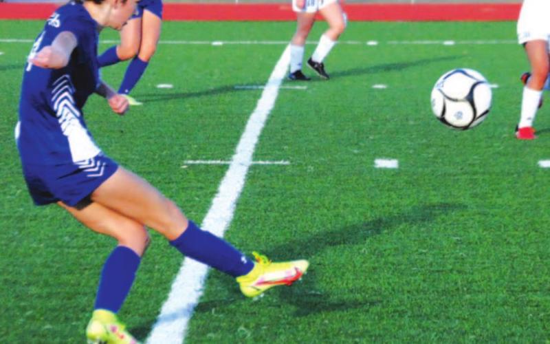 Nyla Long puts in a cross from the right wing during the Lady Badgers’ first district win over Jarrell. HUNTER KING | DISPATCH RECORD