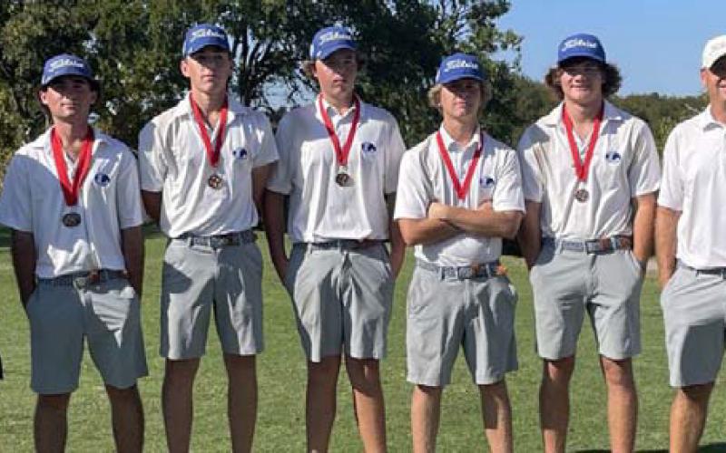 COURTESY PHOTO | GARRY SPORE Members of the Badger golf team pose with their second-place medals.