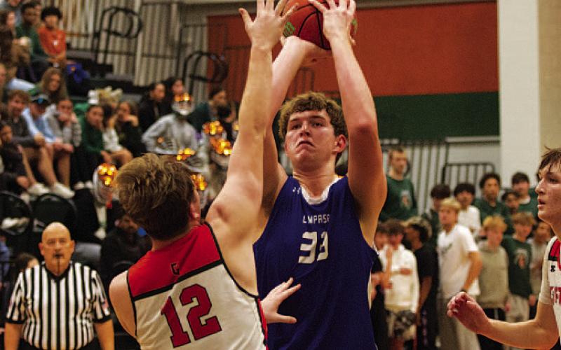 HUNTER KING | DISPATCH RECORD Beau Patterson shoots over a Gateway defender. The junior scored 24 points on Tuesday.