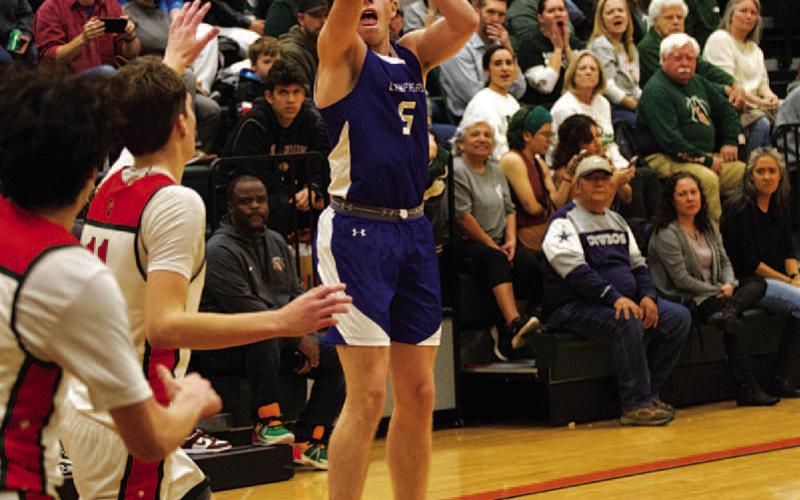 HUNTER KING | DISPATCH RECORD Micah Papke shoots a three-point shot against the Gators.