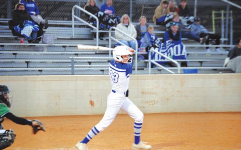 Autumn Beisel-Macomber finishes her swing after hitting the ball against Burnet on Tuesday. HUNTER KING | DISPATCH RECORD