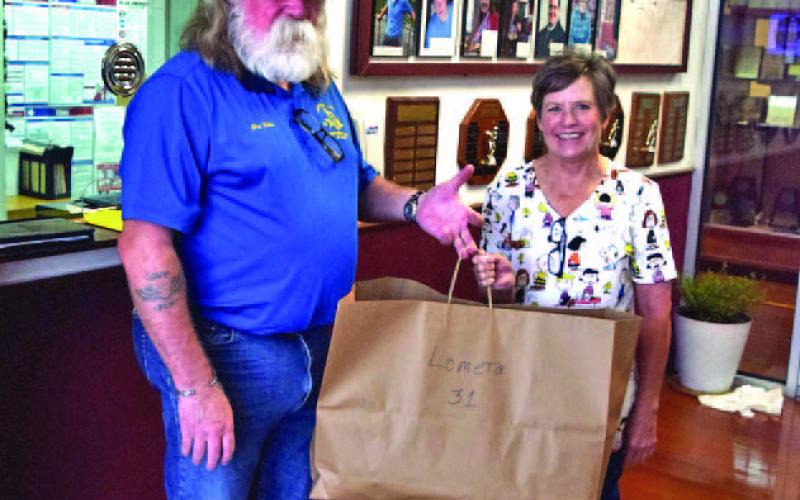 Saratoga Lodge Master Guy R. Niles was on hand to deliver dental kits to Lometa School nurse Monica Ivey for distribution to first-grade students at the campus. COURTESY PHOTO
