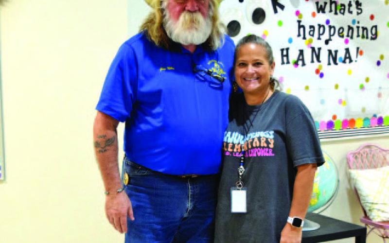 Guy Niles of Saratoga Lodge #546 is shown with Hanna Springs Elementary School nurse Tobi King. The Masonic Charities Program visits local elementary campuses annually to offer dental kits to young students. COURTESY PHOTO