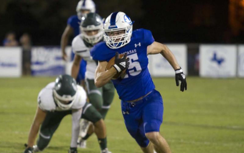 HUNTER KING | DISPATCH RECORD Case Brister breaks loose in the Taylor secondary during the Badgers’ 70-20 win last Friday.