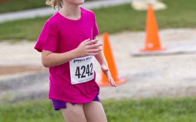 2016 Little Miss Spring Ho Vivien Martin won the female division of the one-mile race. JEFF LOWE | DISPATCH RECORD