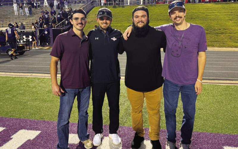 From left, Kord Davis, Derek Whoolery, Pattrick Vasquez and Hunter King pose for a photo after the football game. COURTESY PHOTO