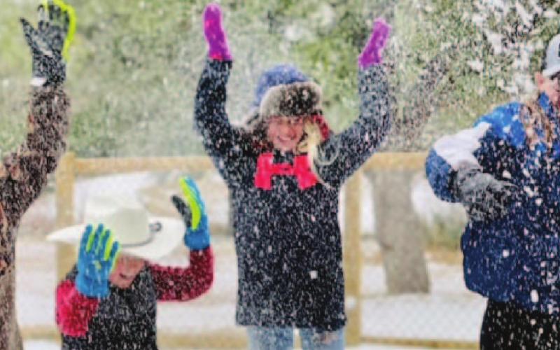 Youth enjoy playing in the snow