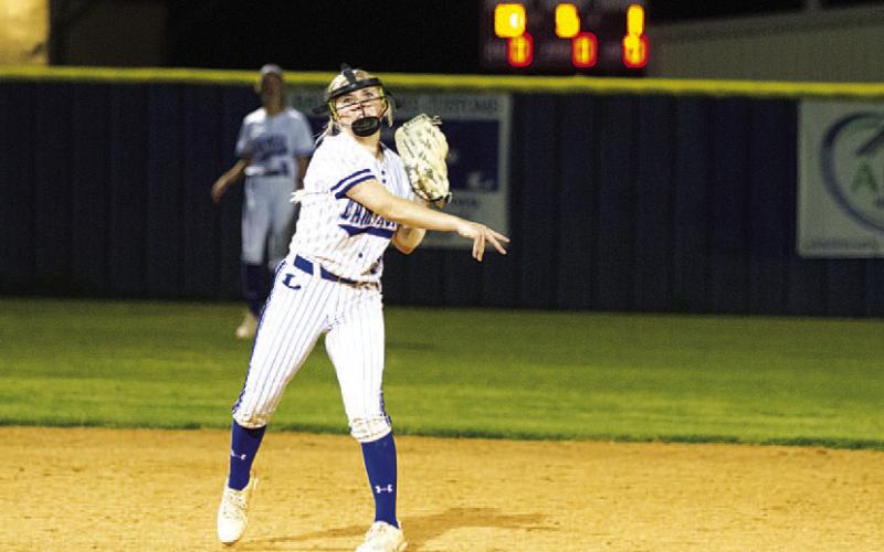 HUNTER KING | DISPATCH RECORD Brady Burton throws to first base to record an out against Taylor.
