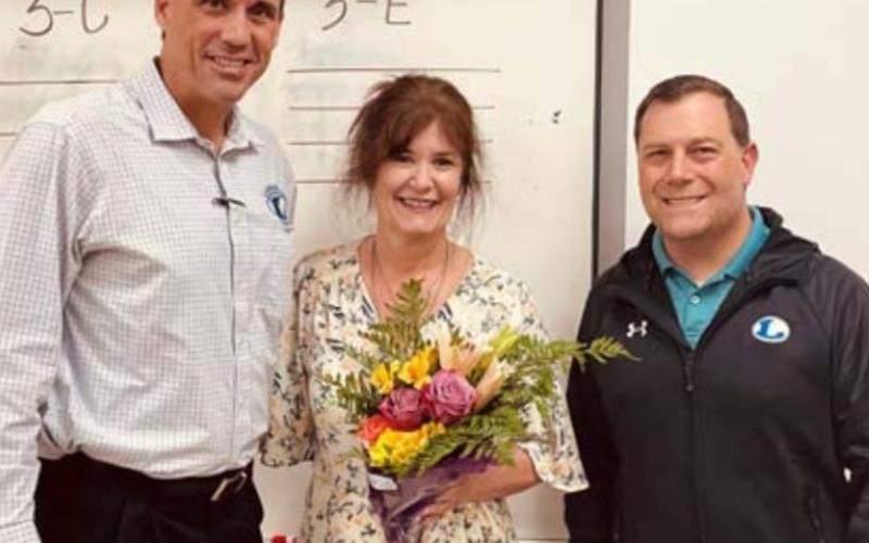 Marie McGuire was named the Secondary Teacher of the Year for the Lampasas Independent School District. She is pictured with Superintendent Dr. Chane Rascoe, left, and Lampasas Middle School Principal Wes Graham. COURTESY PHOTO