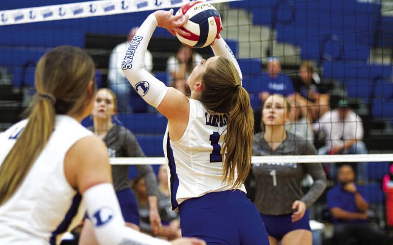 HUNTER KING | DISPATCH RECORD Ava Dowdy sets up a teammate during the match against Jarrell.