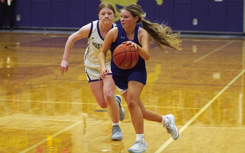 Addison Borchardt drives to the basket during the second half of the game against Marble Falls. HUNTER KING | DISPATCH RECORD