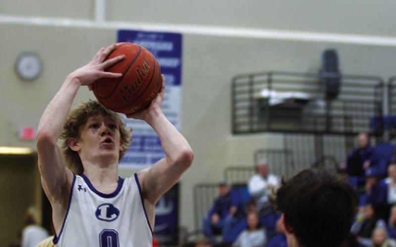 Peyton Sisson pulls up from the free-throw line in the first half of the game. HUNTER KING | DISPATCH RECORD