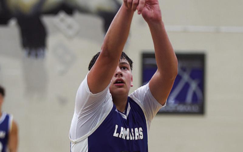 Dylan Polmanteer releases a free throw during Monday night’s game. HUNTER KING | DISPATCH RECORD