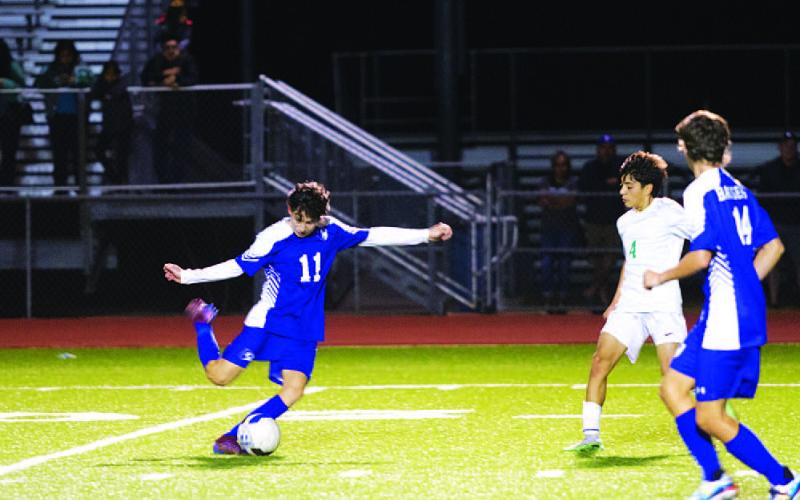 Edwin Gomez sets to shoot during the Badgers’ match against Burnet on Tuesday night. HUNTER KING | DISPATCH RECORD