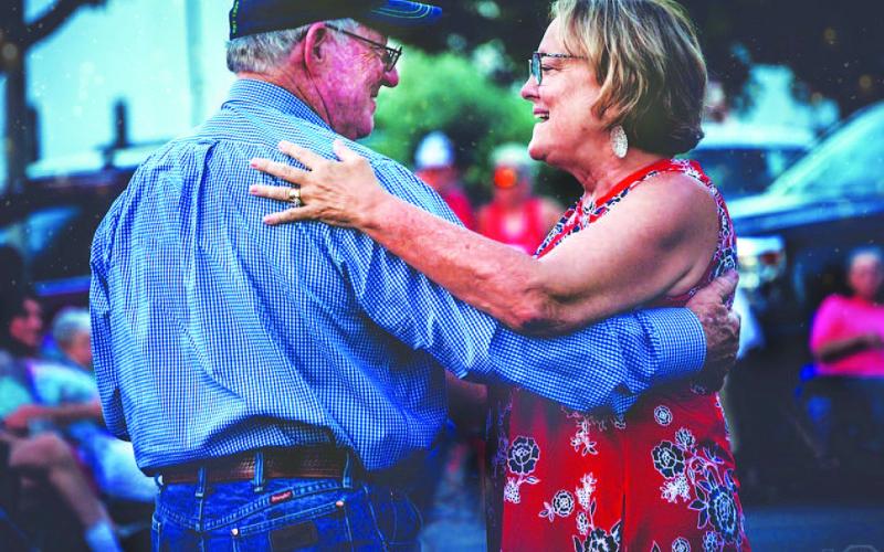 The Edwardses are pictured at a previous Spring Ho concert on the square. They will have a prominent role at this year’s festivities while they serve as parade marshals. COURTESY PHOTO