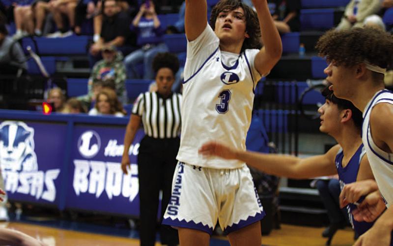 AJ Rosales pulls up for a two-point jumpshot against the Jarrell Cougars. HUNTER KING | DISPATCH RECORD