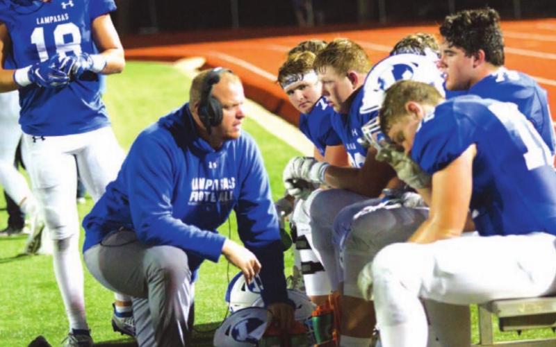 Heath Naragon visits with his offensive line during the 2019 season, when the Badgers went to the state semi-finals. FILE PHOTO