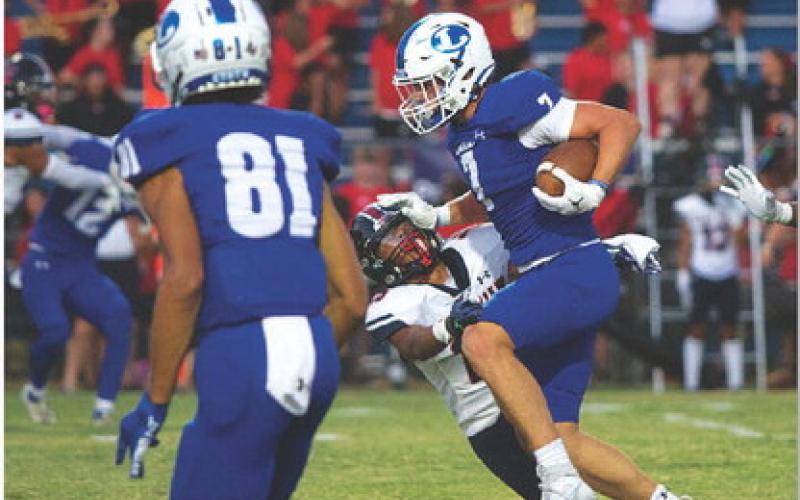 Jett Walker stiff arms an East View defender. The sophomore ran for 166 yards and two touchdowns. HUNTER KING | DISPATCH RECORD