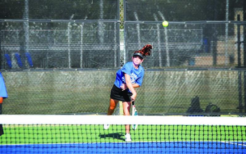 Allison Valdez serves during her doubles match against Gatesville. HUNTER KING | DISPATCH RECORD