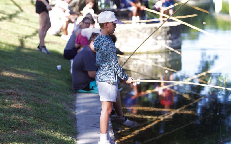 Merritt McDonald waits patiently for a bite from a big fish. HUNTER KING | DISPATCH RECORD