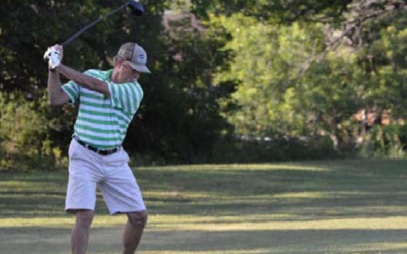Tim Cox, part of a team entered in the upcoming Jeff Urofsky Memorial tournament, tees off at Hancock Park Golf Course. FILE PHOTO