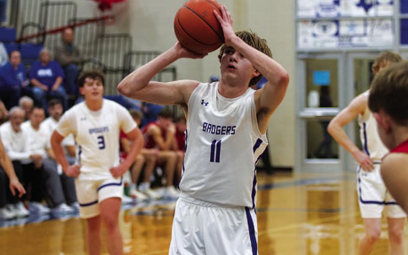 HUNTER KING | DISPATCH RECORD Jax Pratus releases a free throw during an early season game in the Badger Den.