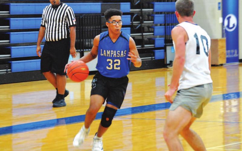 Isaiah Wintle brings the ball up the floor against San Saba on Tuesday afternoon. HUNTER KING | DISPATCH RECORD