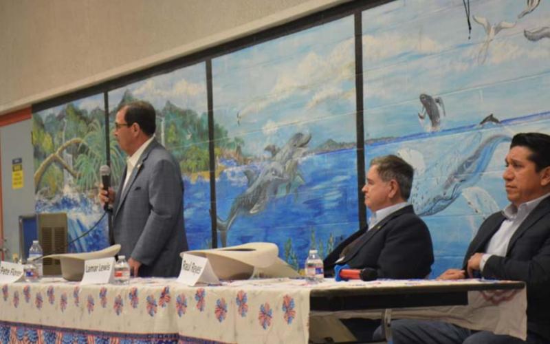 State Senate District 24 candidates Pete Flores, standing, Lamar Lewis and Raul Reyes participated in Tuesday’s forum held inside the old middle school cafeteria. MONIQUE BRAND | DISPATCH RECORD