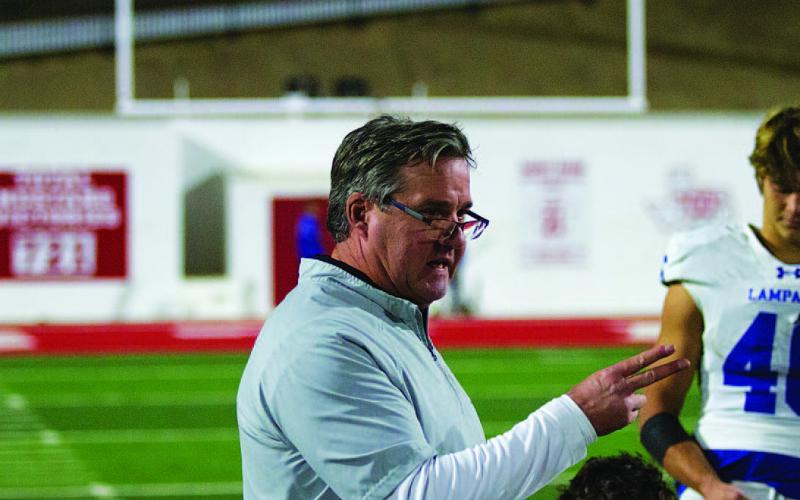 HUNTER KING | DISPATCH RECORD Head coach Troy Rogers addresses his team after the loss last Friday night.