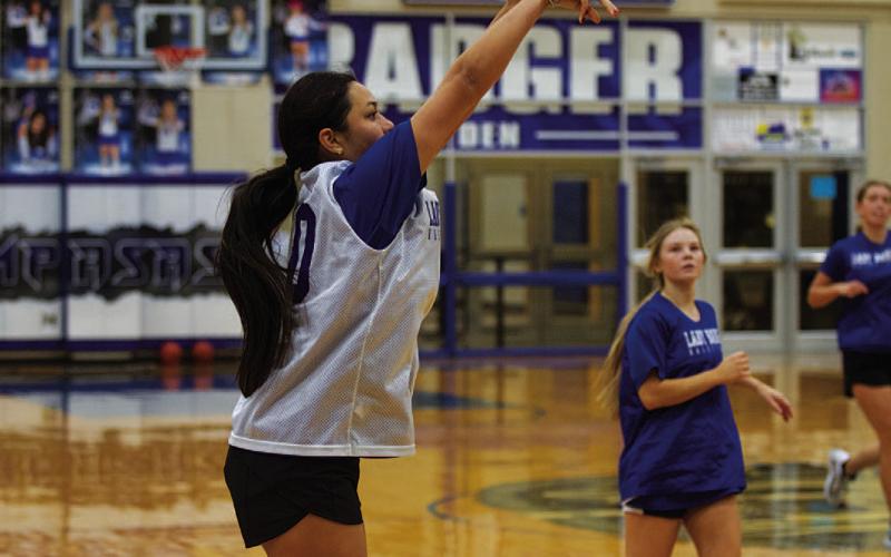 HUNTER KING | DISPATCH RECORD Johnnie Lewis releases a three-point shot during a practice this week.