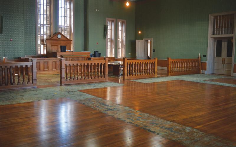 The wood floors of the second-floor district courtroom are being sanded, restained and finished with a coat of polyurethane. Refurbishment of the longleaf pine flooring is expected to be finished next week. erick Mitchell | dispatch record