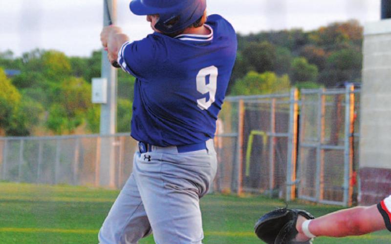 Avery Smith swings at a pitch he drove down the right field line for a hit against Llano on Tuesday. HUNTER KING | DISPATCH RECORD