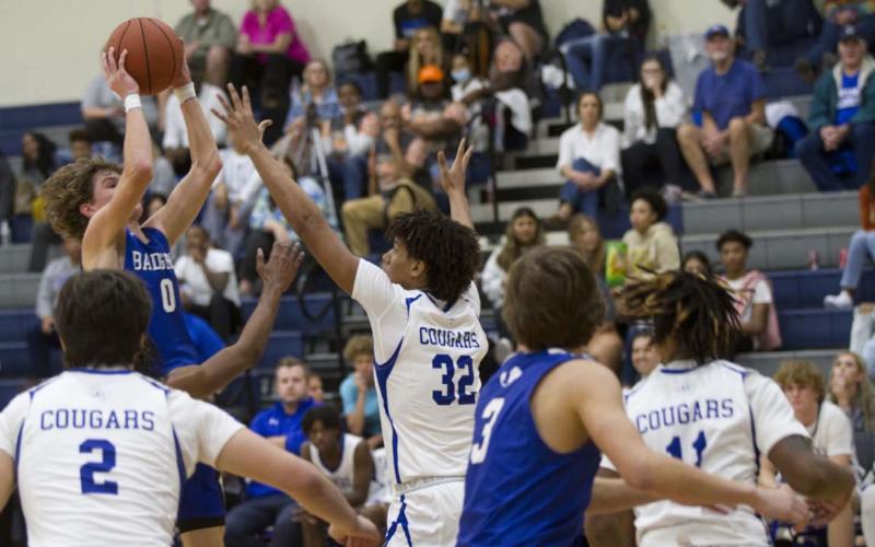 Nate Borchardt goes up over a Jarrell defender for a shot on his way to a 32-point night against the Cougars. HUNTER KING | DISPATCH RECORD