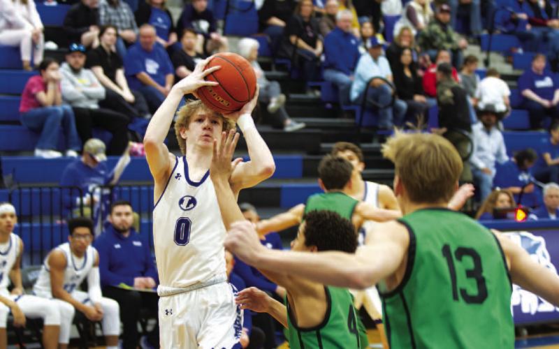 HUNTER KING | DISPATCH RECORD Peyton Sisson rises up over a Burnet defender for a tough two points.