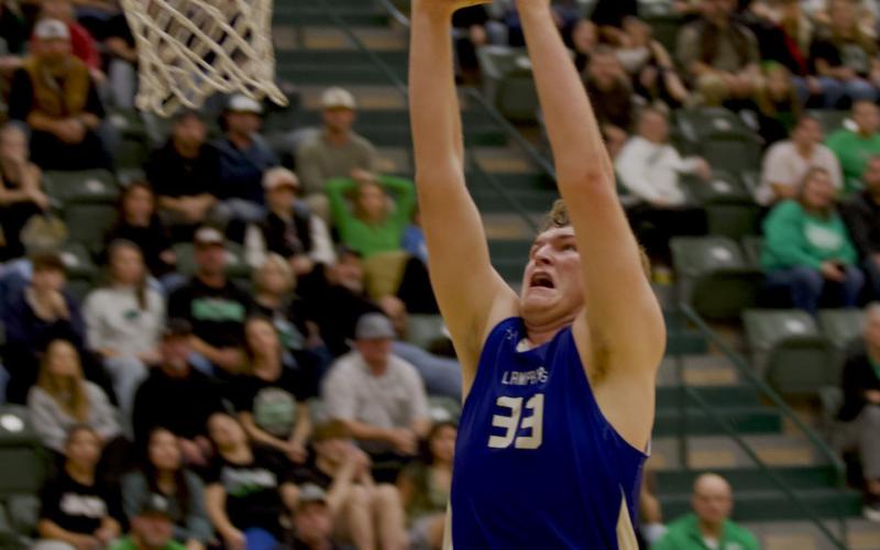 Beau Patterson rises up for the exclamation point slam dunk to finish off the win over Burnet on Friday. HUNTER KING | DISPATCH RECORD