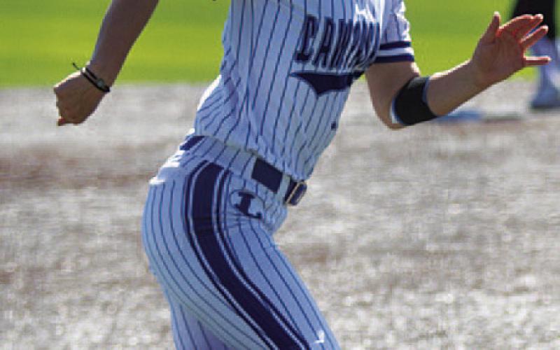 Bre Quarles heads home to score a run for the Lady Badgers. HUNTER KING | DISPATCH RECORD