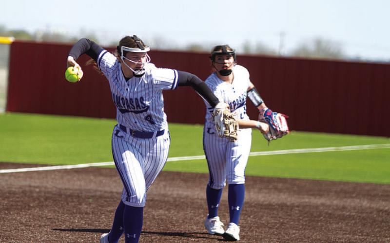 Kamryn Kothmann squares to throw across the diamond for an out during the Lady Badgers’ win against West. HUNTER KING | DISPATCH RECORD