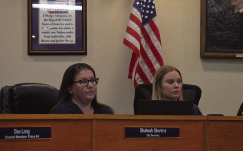 At left, incoming Kempner City Secretary Shaleah Stevens sits next to the outgoing secretary, Hayleigh Talasek, during last week’s council meeting. ERICK MITCHELL | DISPATCH RECORD