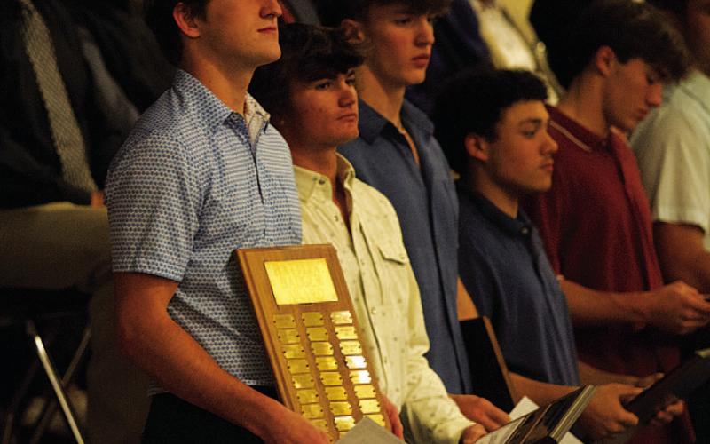 Bryson Roberts, left, stands with the Battlin’ Badger award from last Monday night. HUNTER KING | DISPATCH RECORD