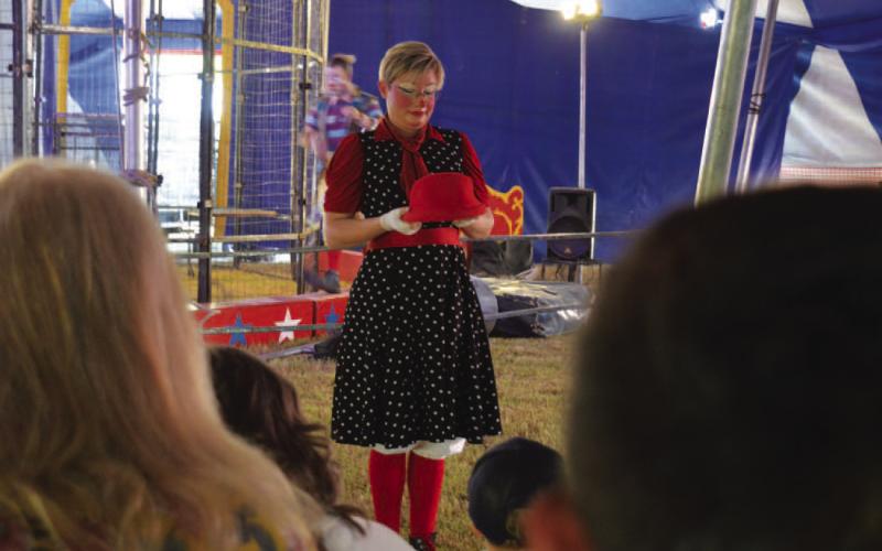 A Culpepper &amp; Merriweather Circus clown entertains attendees before Monday’s show gets underway. ERICK MITCHELL | DISPATCH RECORD