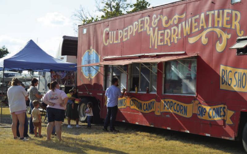 Lampasas residents purchase concessions at the Culpepper &amp;amp; Merriweather Circus trailer before the show. ERICK MITCHELL | DISPATCH RECORD